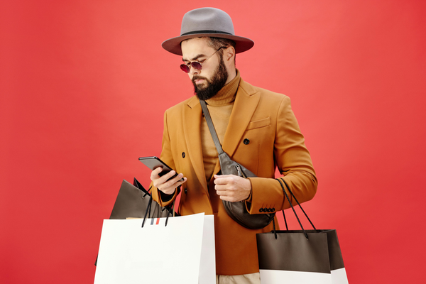 A bearded young man using RateUp WhatsApp loyalty program for his business